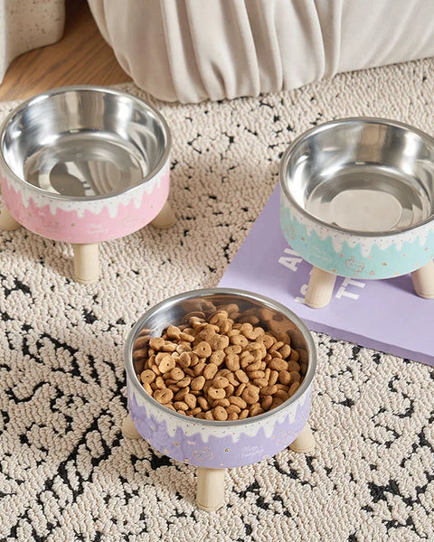 Elevated ice-cream style pet feeding bowl for cats and small to medium dogs designed to improve posture and reduce neck strain during eating and drinking