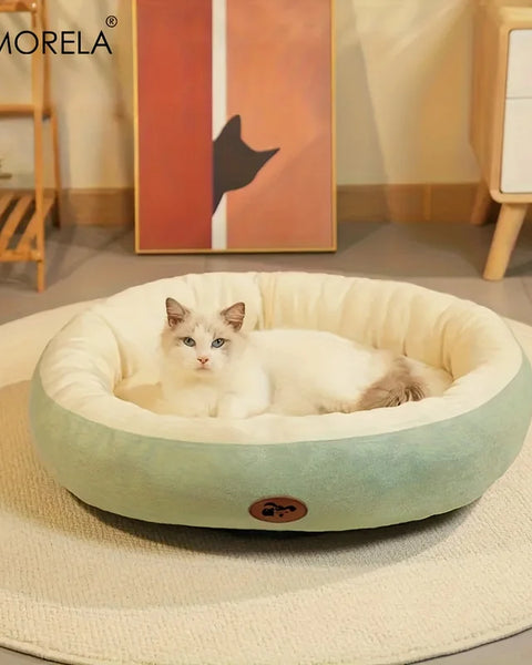Oval plush pet bed for dogs and cats that provides soft cushioning, body support, and a secure resting space for relaxation and sleep.