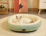 Oval plush pet bed for dogs and cats that provides soft cushioning, body support, and a secure resting space for relaxation and sleep.