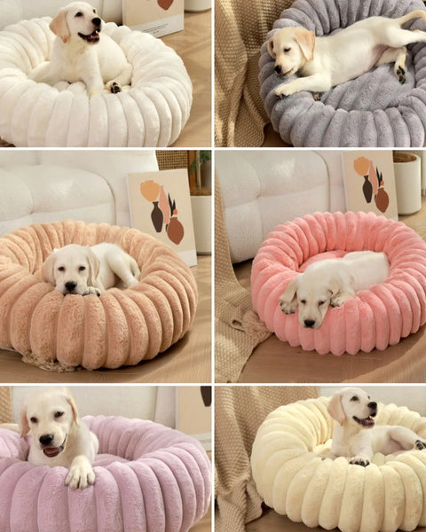 Round plush pet bed for dogs and cats that provides soft cushioning, anxiety relief, and supportive sleep comfort.